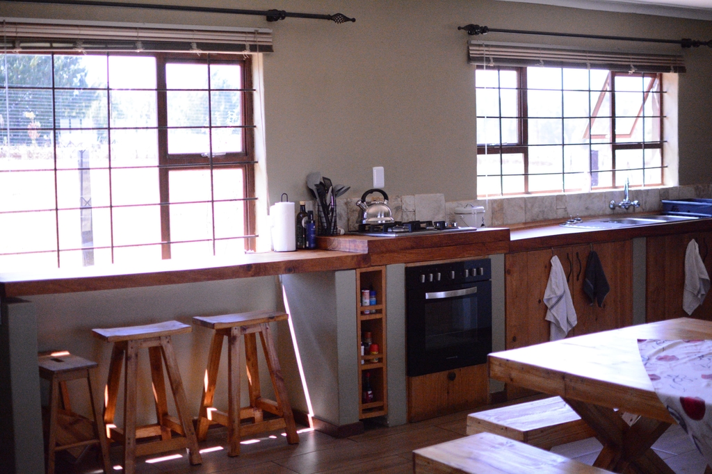 Kitchen counters, stove, and breakfast bar