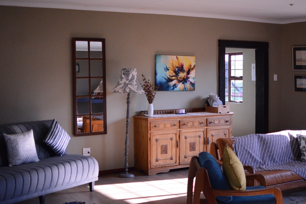 Living room sideboard, sofa, and armchair