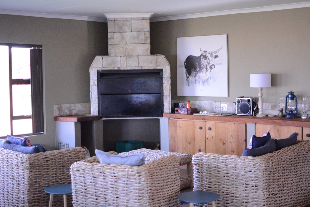 Wicker lounge seating by the fireplace