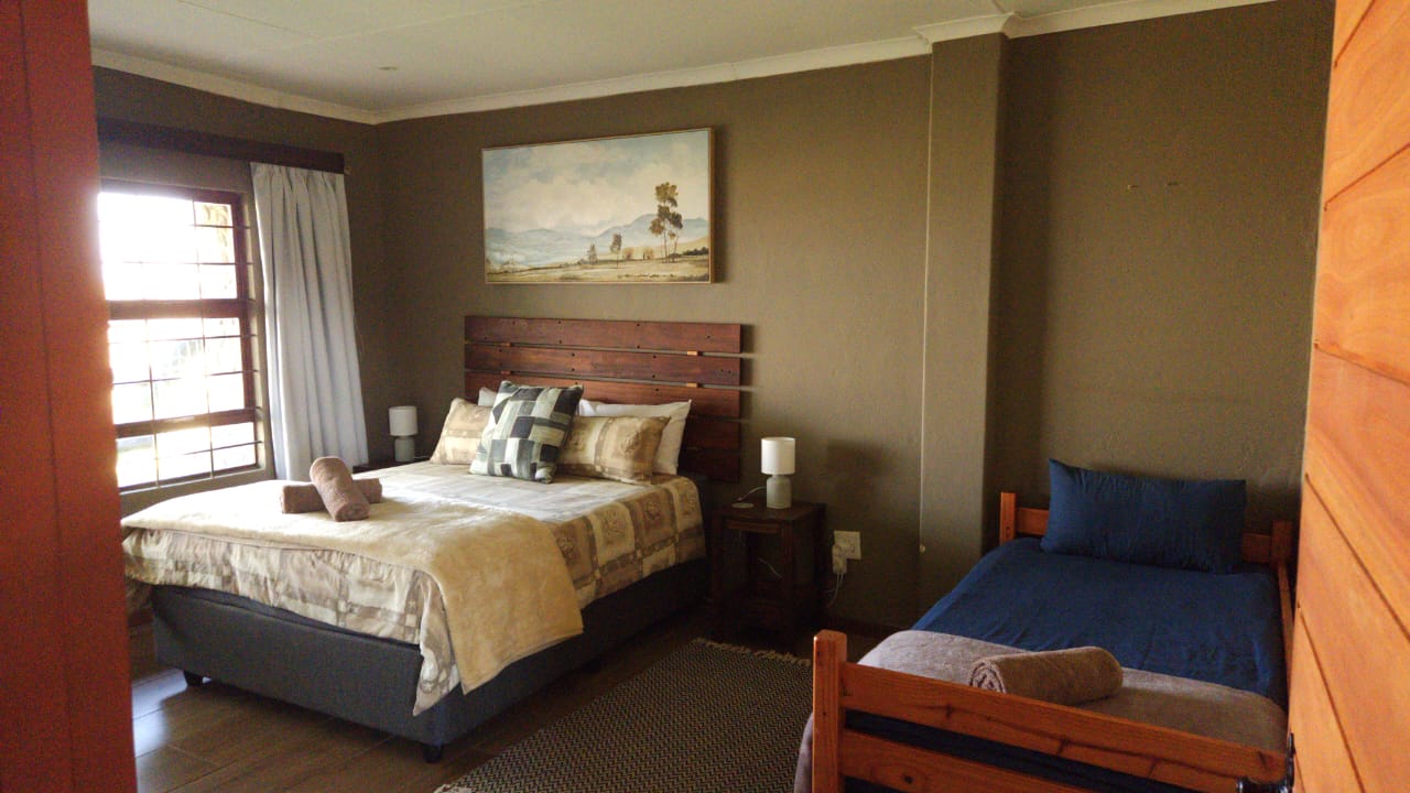 Bedroom with a double bed and a single bed