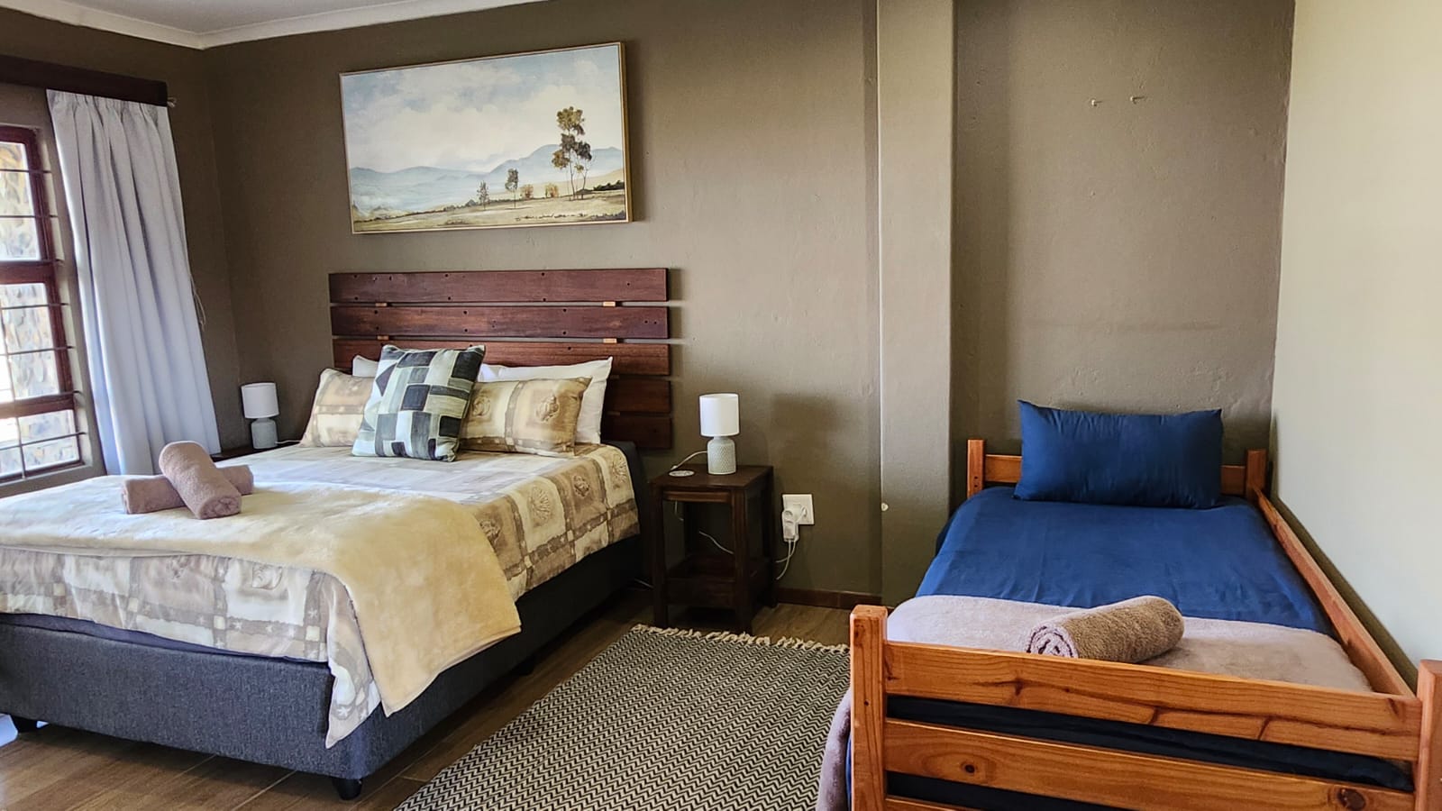 Bedroom with a double bed and a single bed