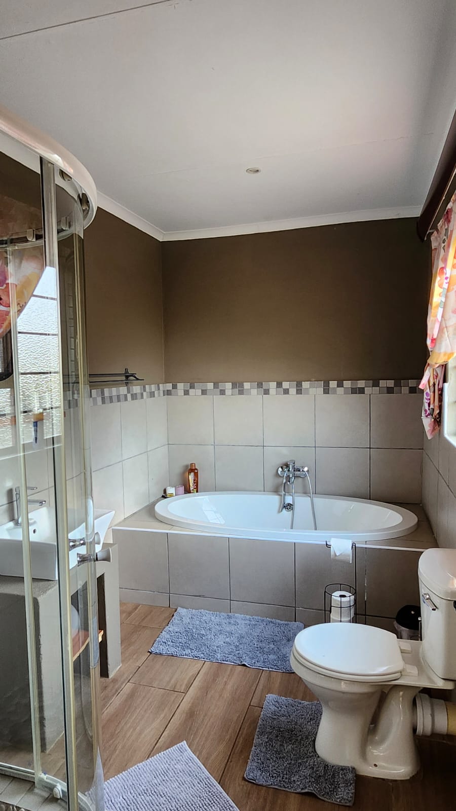 Bathroom with bath, basin, and shower