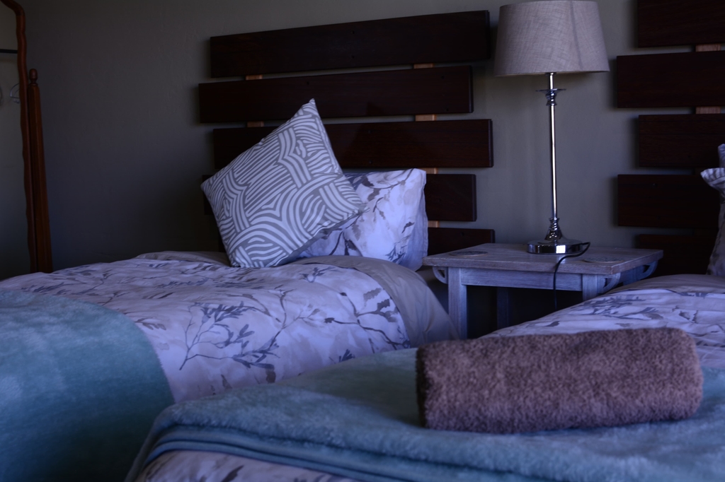 Twin beds with wooden headboards