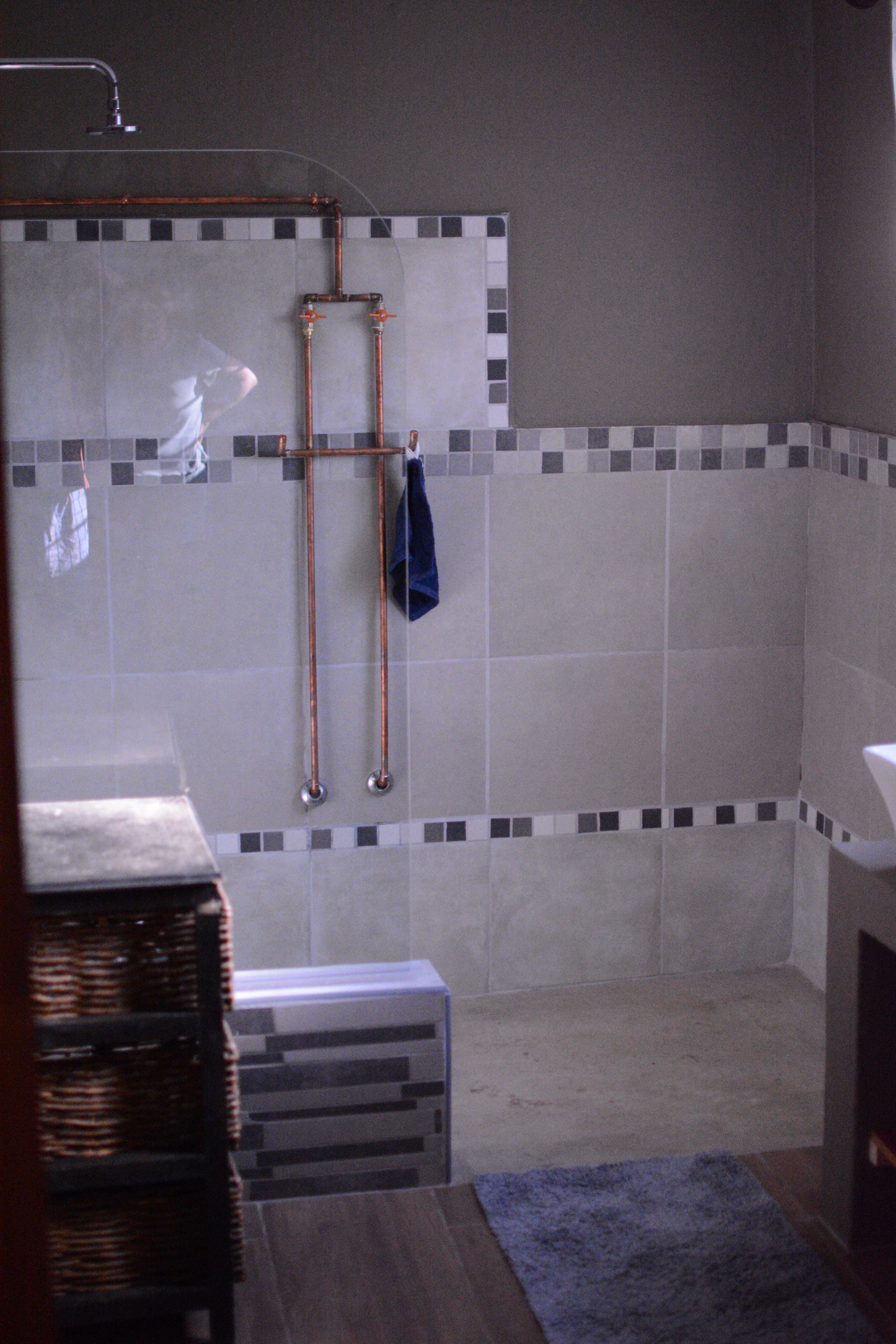 Walk-in shower with copper fittings